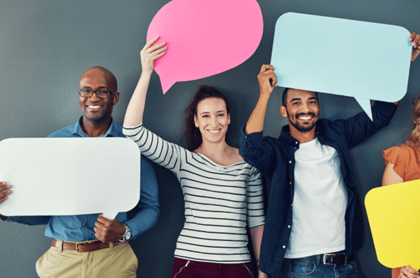 three people holding speech bubbles