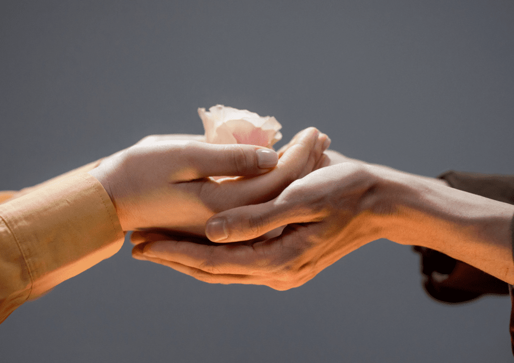 hands with a flower