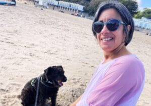 woman on the beach with a dog